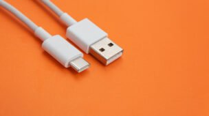 USB cable type C over orange background